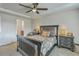 Generous primary bedroom with ceiling fan, dark furniture, and ensuite bathroom entrance at 343 Iveson Rd, Summerville, SC 29486