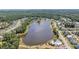 An aerial view of the neighborhood showcasing a large community lake with private homes and amenities at 3894 Sawyers Island Dr, Mount Pleasant, SC 29466