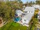 Aerial view of a backyard oasis with pool, putting green, and lush lawn, perfect for luxury living at 3894 Sawyers Island Dr, Mount Pleasant, SC 29466