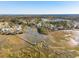 Aerial view of a waterfront community with marsh views, piers, and custom homes at 3894 Sawyers Island Dr, Mount Pleasant, SC 29466
