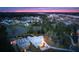 Twilight aerial view of a high end community with lush landscaping and waterfront views at 3894 Sawyers Island Dr, Mount Pleasant, SC 29466