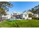 Expansive backyard with a pool, putting green, and lush green lawn, perfect for outdoor activities and relaxation at 3894 Sawyers Island Dr, Mount Pleasant, SC 29466