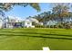 Spacious backyard with putting green, pool, and lush lawn, ideal for entertainment and relaxation at 3894 Sawyers Island Dr, Mount Pleasant, SC 29466