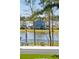 Backyard featuring a lake view, palm trees, and fenced yard at 3894 Sawyers Island Dr, Mount Pleasant, SC 29466