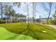 Putting green and green backyard featuring a pond in the distance, creating a serene and private setting at 3894 Sawyers Island Dr, Mount Pleasant, SC 29466