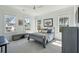 Comfortable bedroom filled with natural light, featuring a cozy bed and large windows with outdoor views at 3894 Sawyers Island Dr, Mount Pleasant, SC 29466