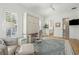 Bright bedroom featuring a wall bed and plenty of natural light streaming through shuttered windows at 3894 Sawyers Island Dr, Mount Pleasant, SC 29466