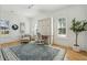 Bright bedroom featuring a wall bed, stylish rug, and plenty of natural light streaming through shuttered windows at 3894 Sawyers Island Dr, Mount Pleasant, SC 29466