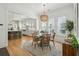Bright dining area featuring a round table, decorative rug and light fixture with an open view to the kitchen at 3894 Sawyers Island Dr, Mount Pleasant, SC 29466