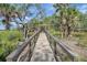 Path to the dock with lush trees and an inviting gated entrance at 3894 Sawyers Island Dr, Mount Pleasant, SC 29466