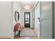 Bright entryway features hardwood floors, a wooden bench with pillows, stylish chandelier, and sliding barn doors at 3894 Sawyers Island Dr, Mount Pleasant, SC 29466
