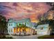 Charming two-story coastal home with a well-manicured lawn and lush tropical landscaping at 3894 Sawyers Island Dr, Mount Pleasant, SC 29466