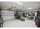 Spacious two-car garage with storage racks, coated floors, and overhead lighting at 3894 Sawyers Island Dr, Mount Pleasant, SC 29466