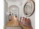 Inviting hallway with hardwood floors, stylish décor, and a view of the backyard at 3894 Sawyers Island Dr, Mount Pleasant, SC 29466