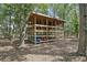 Community kayak storage rack with kayaks ready for water activities in a beautiful wooded setting at 3894 Sawyers Island Dr, Mount Pleasant, SC 29466