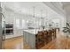 Open-concept kitchen with an oversized island, seating, modern appliances, and hardwood flooring at 3894 Sawyers Island Dr, Mount Pleasant, SC 29466