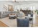 A comfortable living room is shown with modern furnishings, and stairs in the background at 3894 Sawyers Island Dr, Mount Pleasant, SC 29466