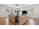 Bright and airy living room featuring a large sectional sofa and hardwood floors at 3894 Sawyers Island Dr, Mount Pleasant, SC 29466
