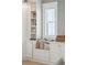 A cozy reading nook by the window features custom built-in shelving and storage at 3894 Sawyers Island Dr, Mount Pleasant, SC 29466