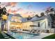 The backyard features a beautiful pool, lounge chairs, grilling area and covered patio at 3894 Sawyers Island Dr, Mount Pleasant, SC 29466
