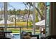 Views of a pool and community lawn are available from the inside, with chairs available on the patio at 3894 Sawyers Island Dr, Mount Pleasant, SC 29466