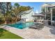 Backyard pool with waterfalls, lounge chairs and patio area, perfect for outdoor relaxation and entertaining at 3894 Sawyers Island Dr, Mount Pleasant, SC 29466