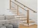 Beautiful staircase with a wood railing and natural light coming into the home at 3894 Sawyers Island Dr, Mount Pleasant, SC 29466