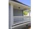Inviting side porch featuring classic white railings, decorative columns, and ample space at 399 Stefan Dr, Charleston, SC 29412