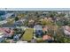 Wide view of the property featuring a two-story home with a metal roof and fenced lawn at 4 Kenilworth Ave, Charleston, SC 29403