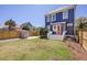 Expansive backyard boasts a lush lawn, privacy fence, storage shed, and mature landscaping at 4 Kenilworth Ave, Charleston, SC 29403