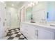 Bathroom features double sink vanity, granite countertops, tile floors, and glass shower at 4 Kenilworth Ave, Charleston, SC 29403