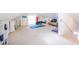 Bright bonus room features neutral carpet, fitness area, and built-in bookshelves for organization and a cozy space at 4 Kenilworth Ave, Charleston, SC 29403