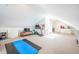 Bright bonus room features neutral carpet, fitness area, natural light, and ample storage space at 4 Kenilworth Ave, Charleston, SC 29403