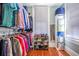 Walk-in closet features custom storage and organization system with natural light at 4 Kenilworth Ave, Charleston, SC 29403