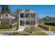 Charming two-story home features a classic porch, manicured lawn, and inviting curb appeal at 4 Kenilworth Ave, Charleston, SC 29403
