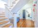 Entryway hallway with hardwood flooring and staircase leading to the upper level at 4 Kenilworth Ave, Charleston, SC 29403