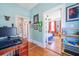 A bright hallway featuring hardwood floors, and a view to the Primary bedroom at 4 Kenilworth Ave, Charleston, SC 29403