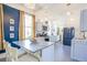 A gourmet kitchen featuring a marble island, stainless steel appliances, and bright lighting at 4 Kenilworth Ave, Charleston, SC 29403