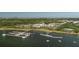Beautiful aerial of waterfront condos with boat docks, lush greenery and serene water views at 400 Bucksley Ln # 103, Charleston, SC 29492