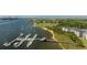 Aerial view of waterfront condos with private docks, boats, and scenic coastal views at 400 Bucksley Ln # 103, Charleston, SC 29492