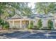 Community clubhouse with well-maintained landscaping and ample parking at 400 Bucksley Ln # 103, Charleston, SC 29492