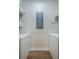 Functional laundry area with side-by-side washer and dryer, and wood look flooring at 400 Bucksley Ln # 103, Charleston, SC 29492