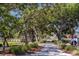 Walking path among the trees in a tranquil community setting at 400 Bucksley Ln # 103, Charleston, SC 29492