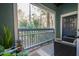 Open-air patio offering scenic views of lush trees and inviting outdoor furniture at 400 Bucksley Ln # 103, Charleston, SC 29492