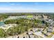 Aerial view of community, highlighting the convenient pool and lake, surrounded by lush, mature landscaping at 4021 Brown Trout Dr, Johns Island, SC 29455
