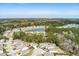 Aerial view of property and lake, showcasing the landscape and a peaceful community at 4021 Brown Trout Dr, Johns Island, SC 29455