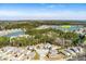 Aerial view of the property, community pool, and a beautiful lake, highlighting the desirable location at 4021 Brown Trout Dr, Johns Island, SC 29455