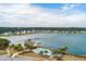Aerial view showcasing a community pool, lake, and well-maintained landscape at 4021 Brown Trout Dr, Johns Island, SC 29455
