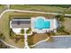 Aerial view of community pool and cabana, surrounded by lush landscaping at 4021 Brown Trout Dr, Johns Island, SC 29455