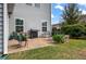 Outdoor patio with grill, seating, and a firepit, perfect for entertaining in the beautifully landscaped backyard at 4021 Brown Trout Dr, Johns Island, SC 29455